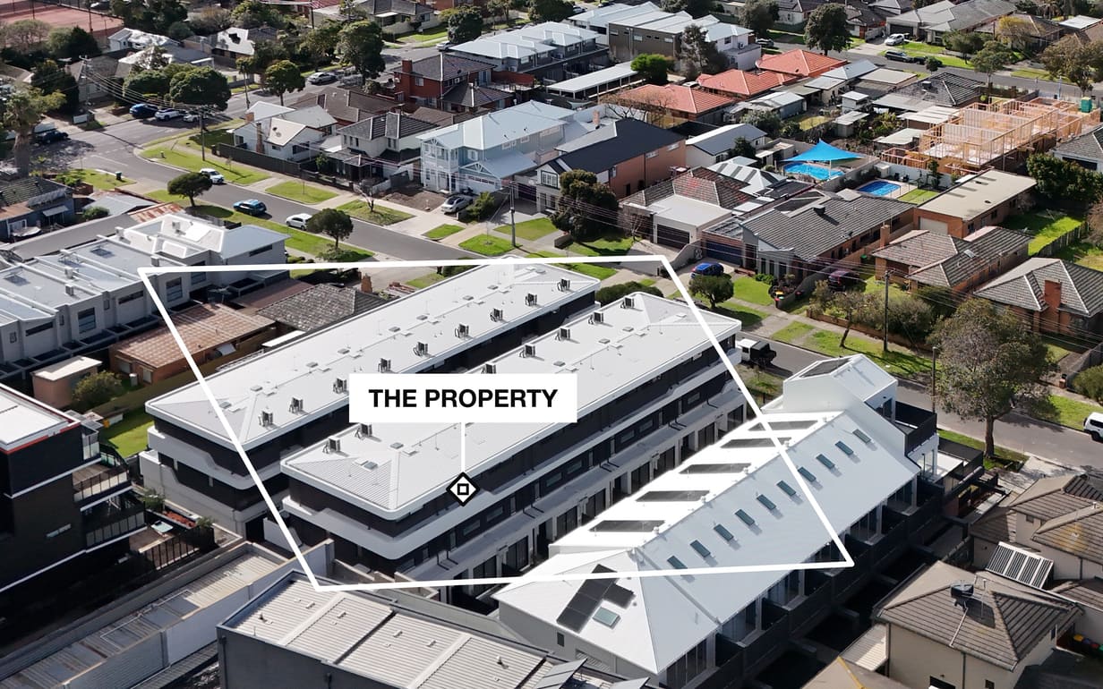 A real boundary from the Pin the Lot engine: a four-point outline drawn by the operator in one clean white line on our own drone photo, the property plate inside it. Not a lot line: no cadastral provider exists.